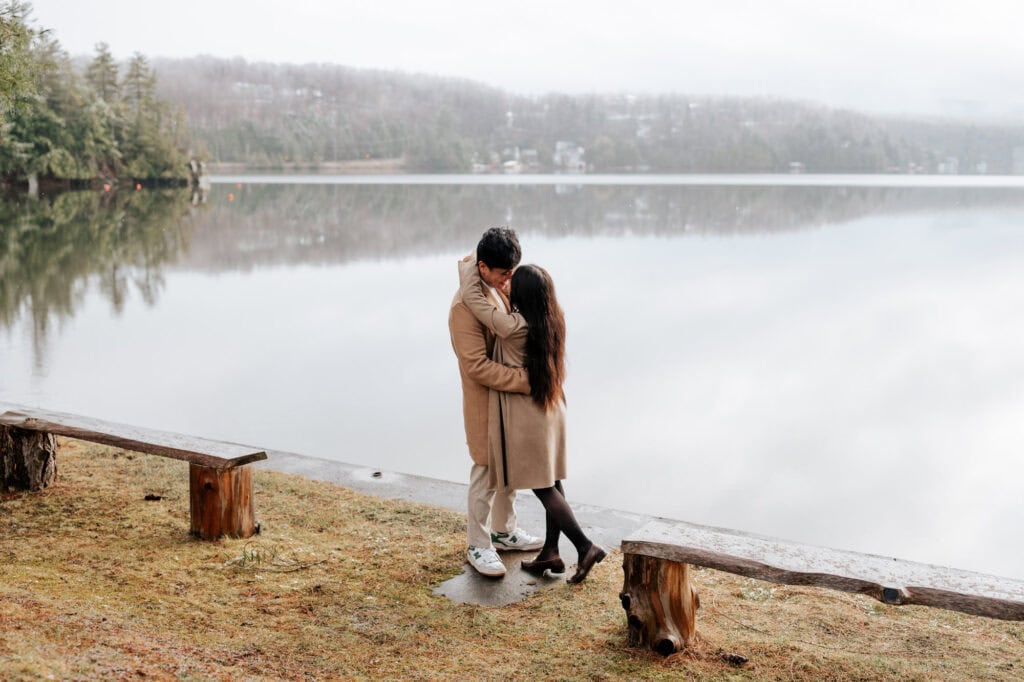 Couple kissing by the lake after a proposal at Ripple Cove in Ayer's Cliff, Eastern Townships, Quebec