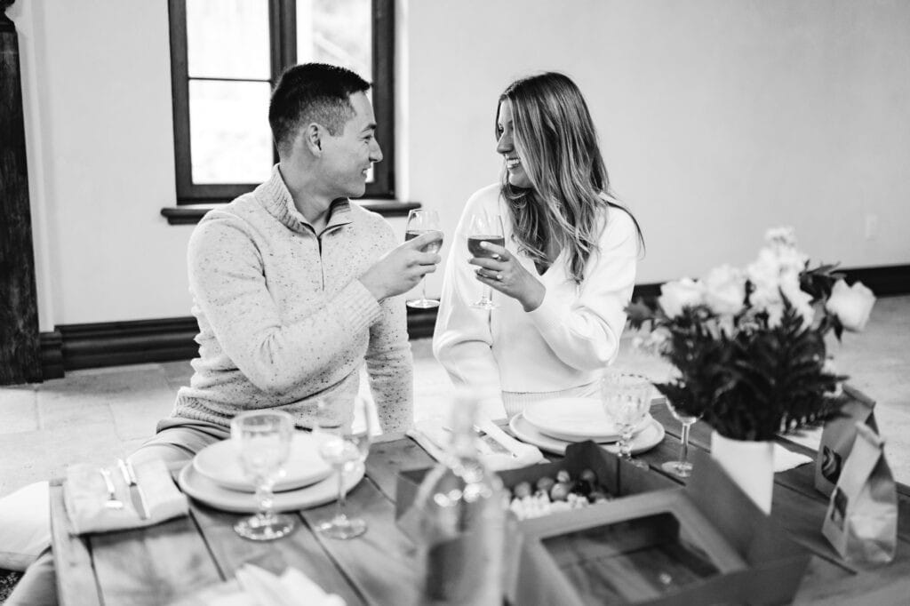 Couple celebrating their engagement with a wine toast at Château Sainte-Agnès in Sutton, Eastern Townships